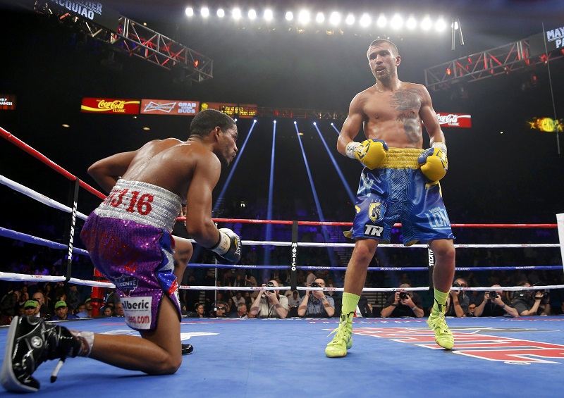 Vasyl Lomachenko of Ukraine looks on as Gamalier Rodriguez of Puerto Rico goes down in the ninth round during their 12 round WBO featherweight title fight in Las Vegas, Nevada May 2, 2015. REUTERS/Steve Marcus